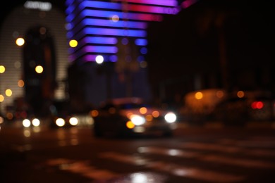 Photo of Blurred view of cityscape with bokeh effect. Night life