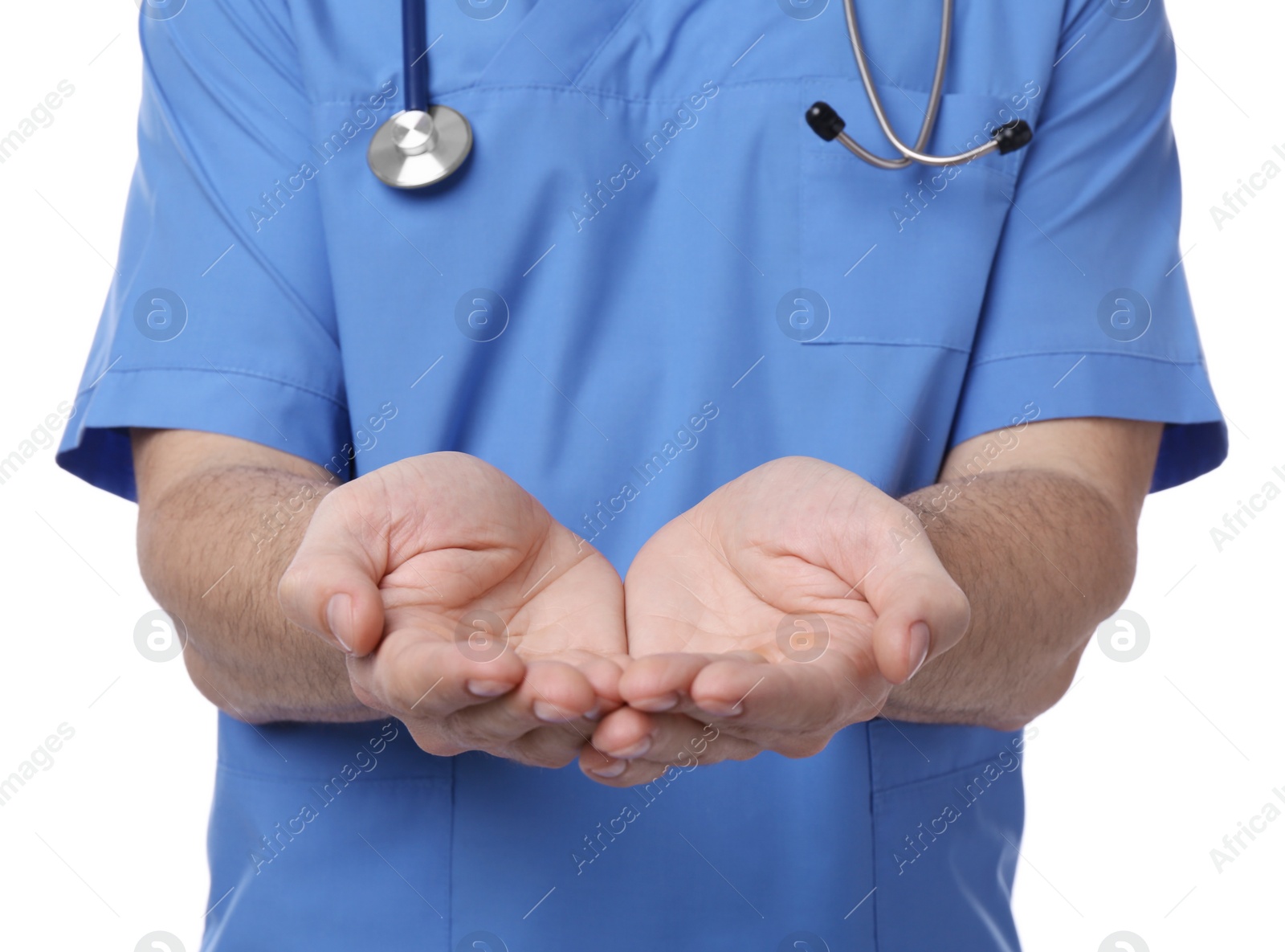 Photo of Doctor with stethoscope holding something on white background, closeup. Cardiology concept