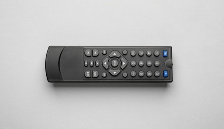 Remote control on light grey background, top view