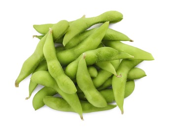 Raw green edamame pods on white background, top view