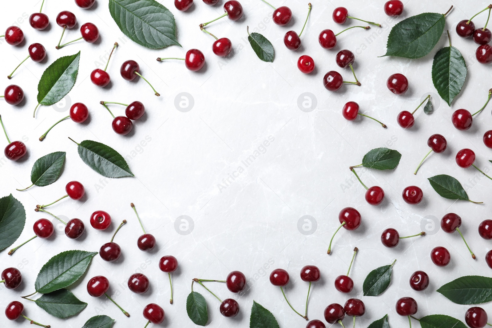 Photo of Sweet juicy cherries on white table, flat lay. Space for text