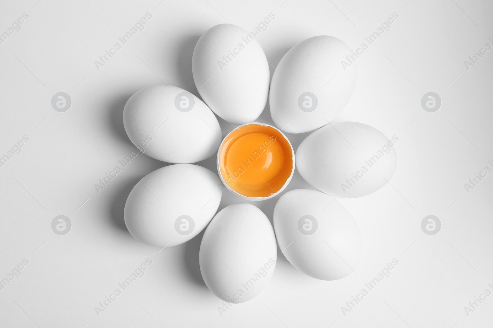 Photo of Fresh raw chicken eggs on white background, flat lay