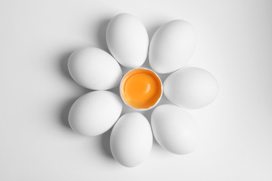 Photo of Fresh raw chicken eggs on white background, flat lay