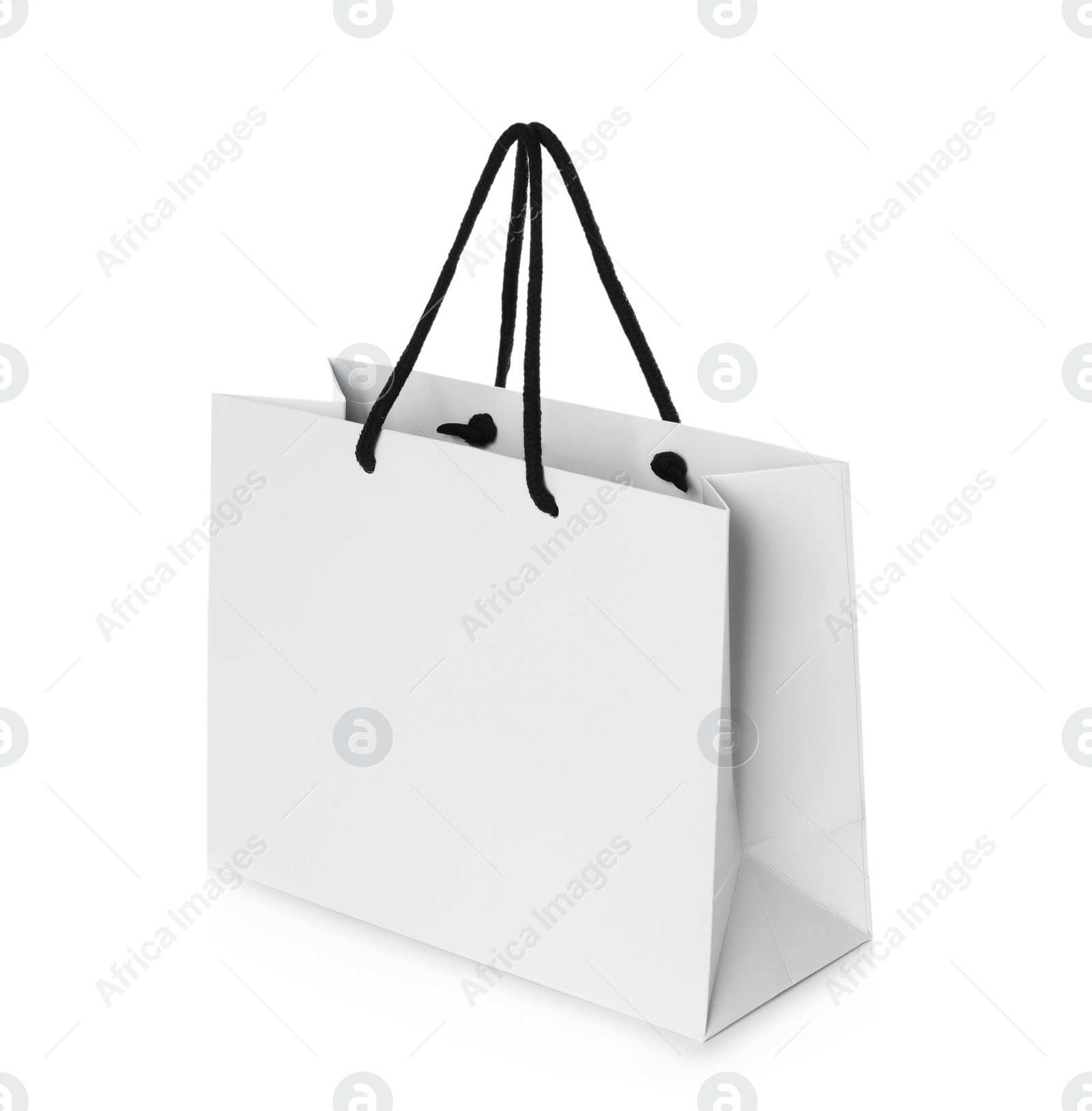 Photo of Paper shopping bag isolated on white. Mock up for design