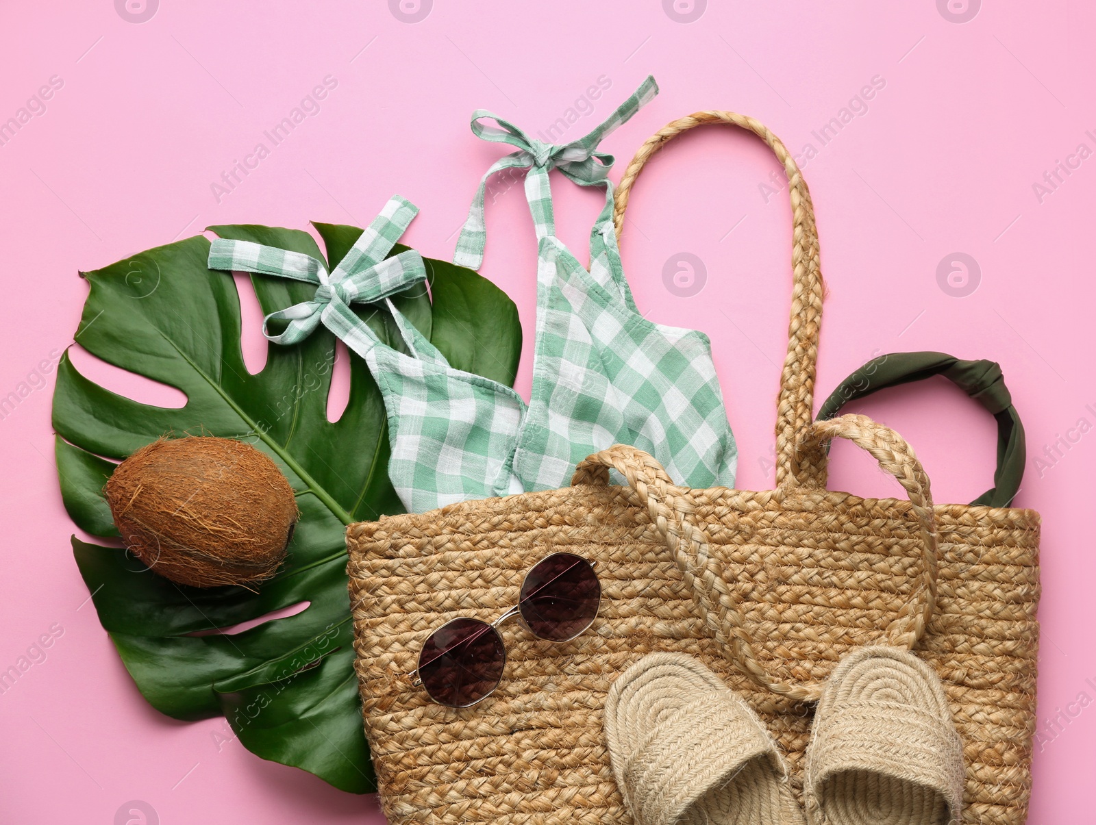 Photo of Flat lay composition with woman's straw bag on pink background