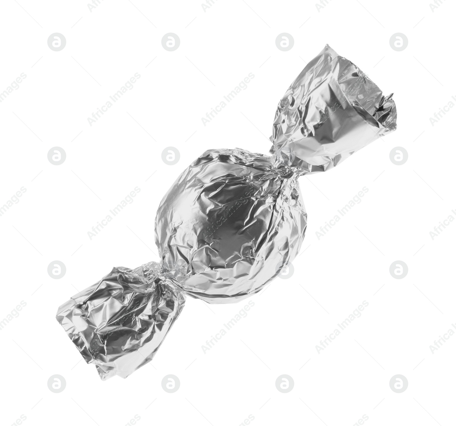 Photo of Tasty candy in silver wrapper isolated on white