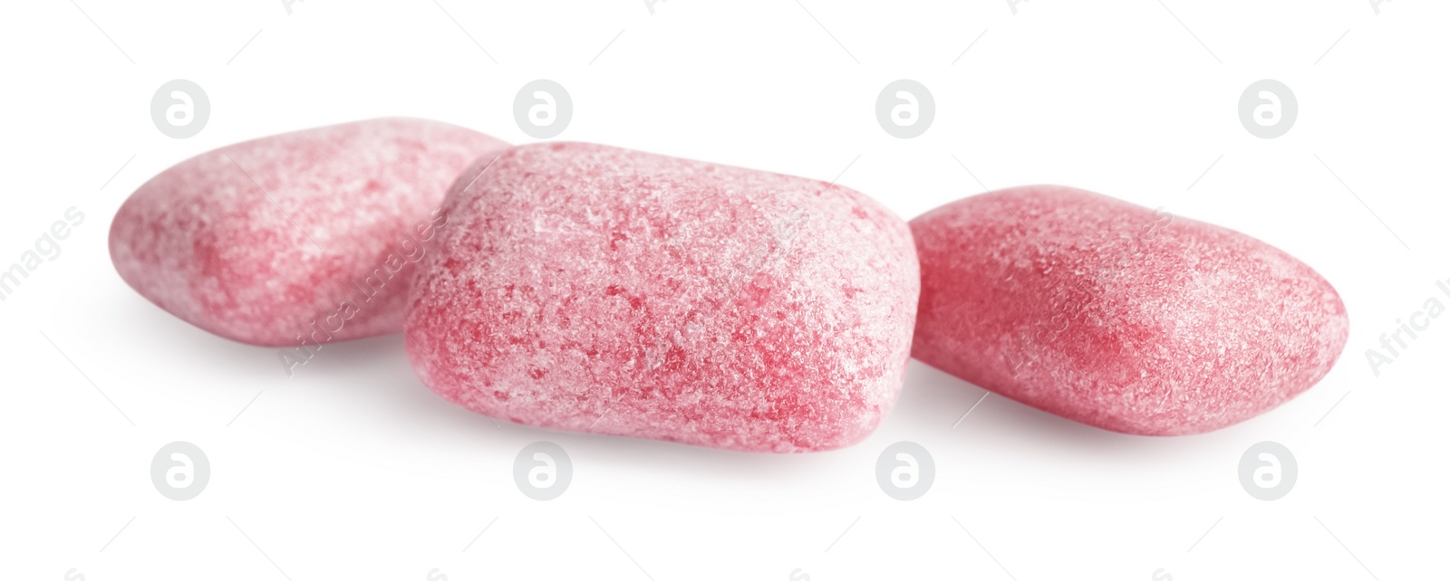 Photo of Tasty sweet chewing gums on white background