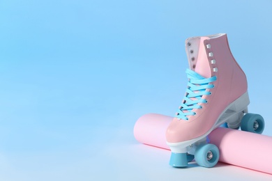 Composition with vintage roller skate on color background. Space for text