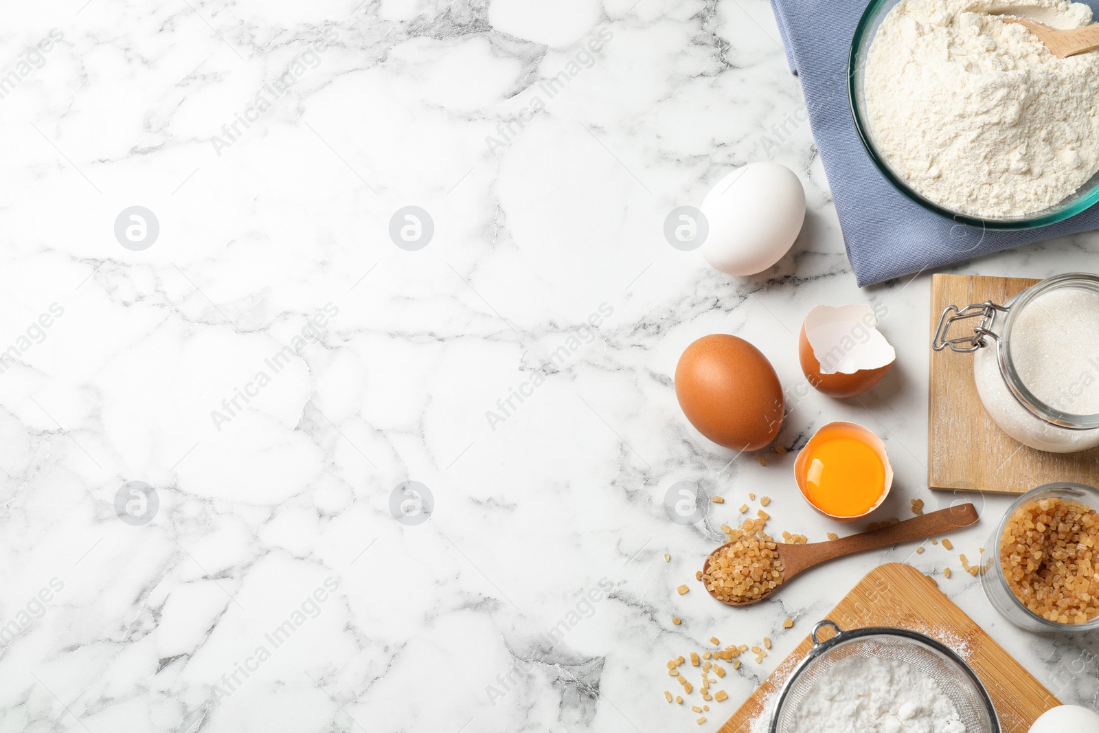 Photo of Flat lay composition with fresh ingredients for delicious homemade cake on white marble table. Space for text