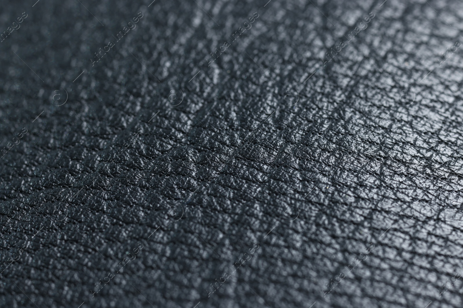 Photo of Black natural leather as background, closeup view