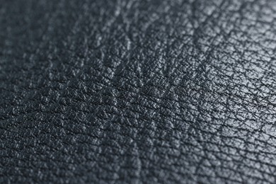 Black natural leather as background, closeup view