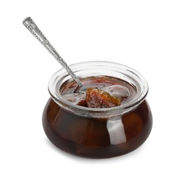 Photo of Jar of tasty sweet fig jam and spoon isolated on white