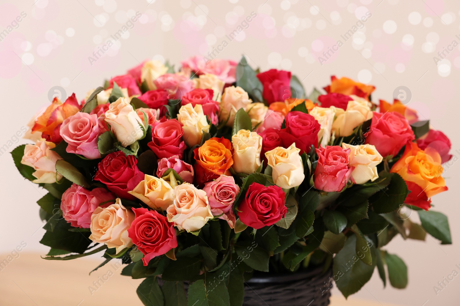 Photo of Bouquet of beautiful roses on light background