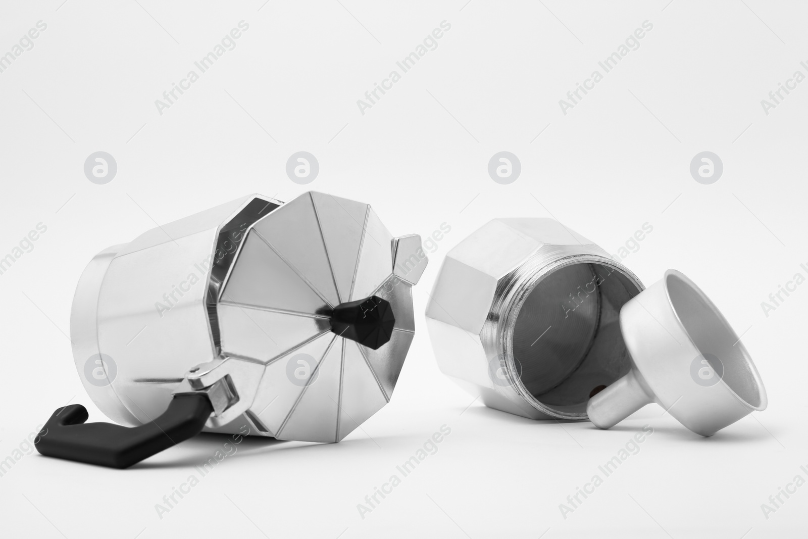 Photo of Disassembled moka pot on white background. Coffee maker