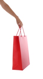 Photo of Woman with paper shopping bag on white background, closeup