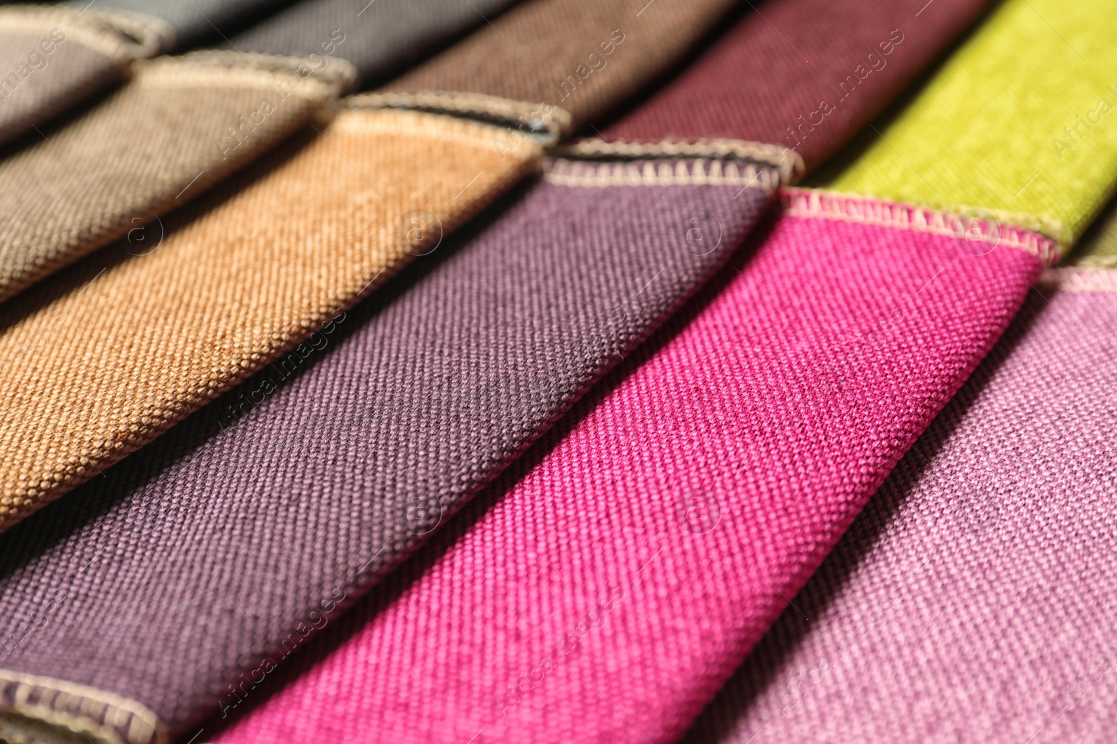 Photo of Fabric samples of different colors for interior design as background