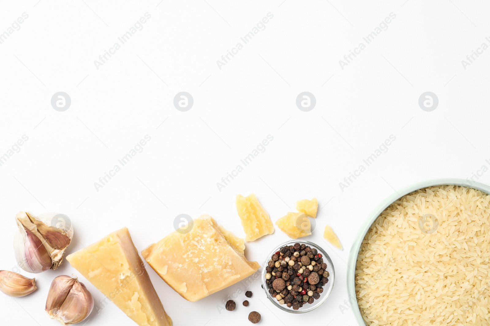 Photo of Different ingredients on white background, top view. Risotto recipe