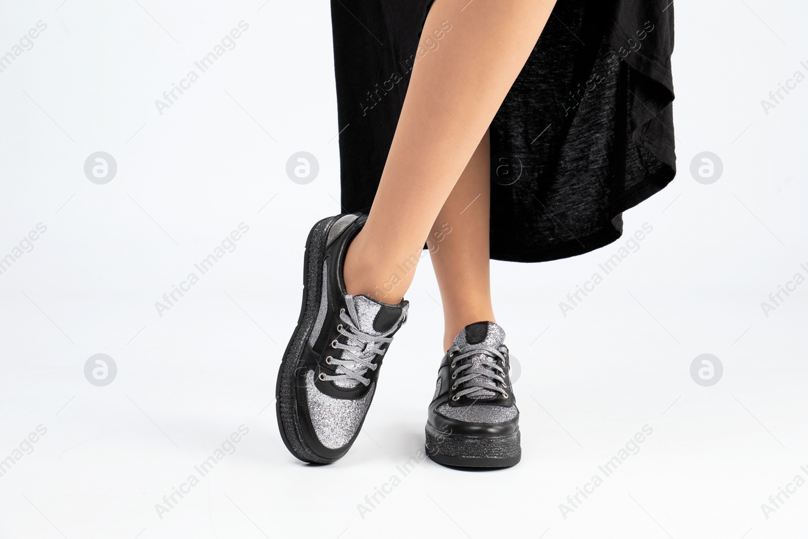 Photo of Woman in stylish shoes on white background, closeup