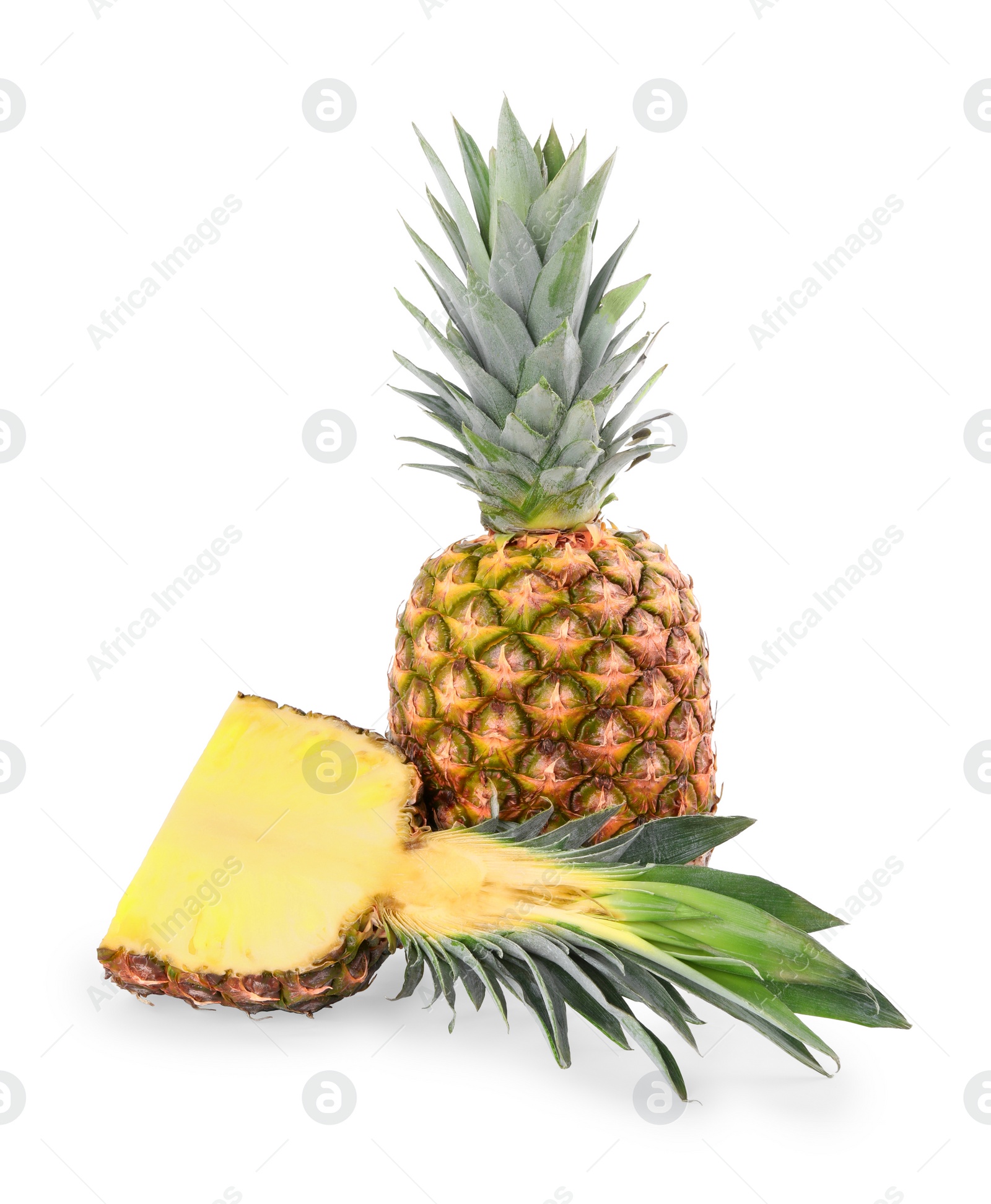 Photo of Whole and cut ripe pineapples isolated on white