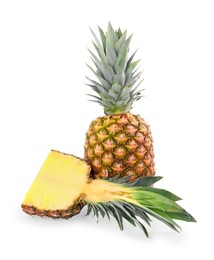 Photo of Whole and cut ripe pineapples isolated on white