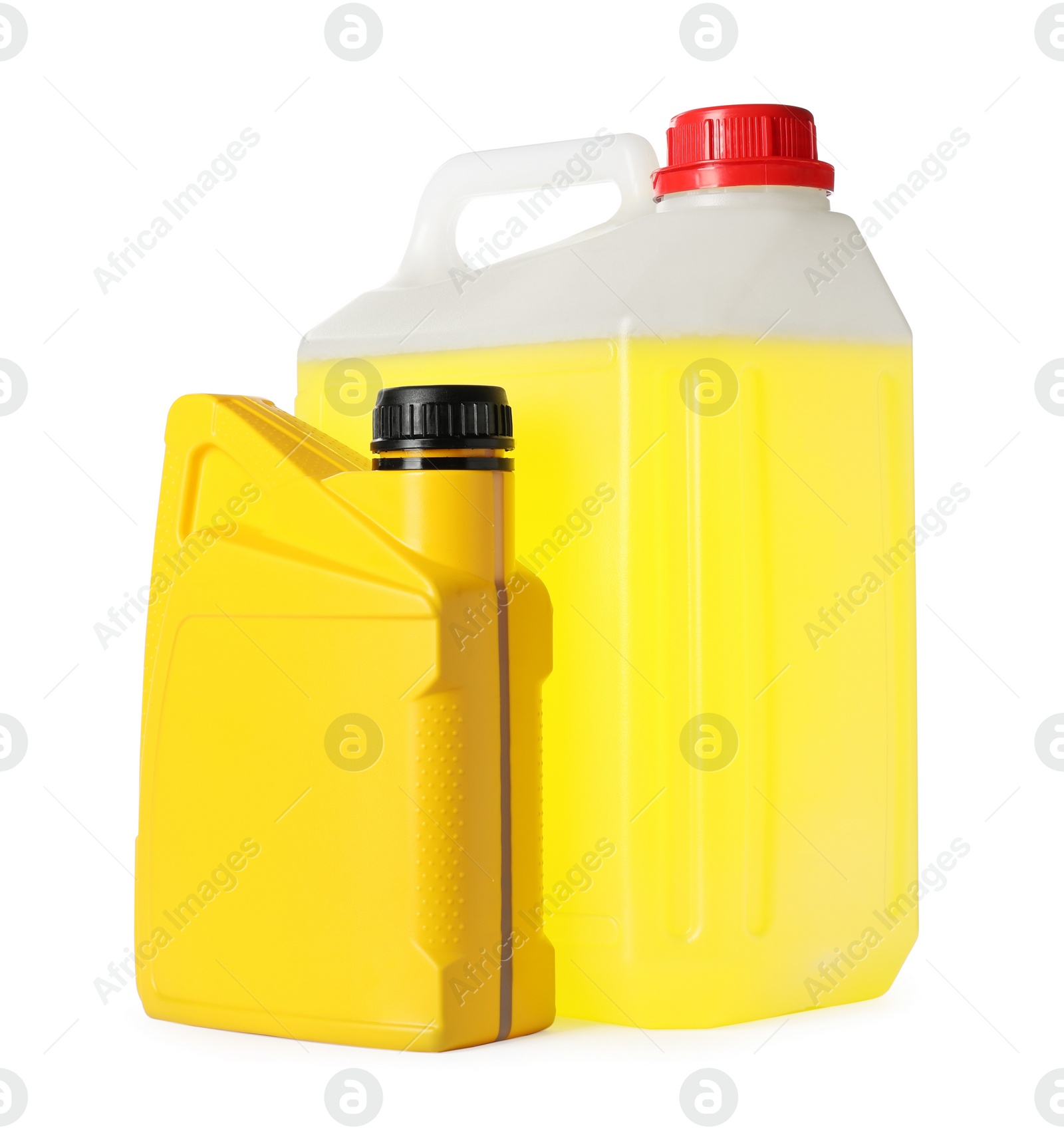 Photo of Yellow canisters with liquids on white background