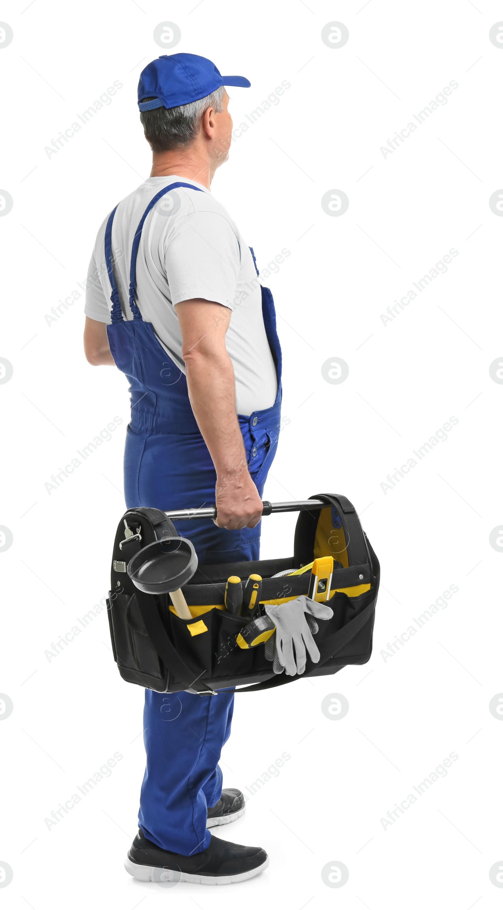 Photo of Mature plumber with tool bag on white background