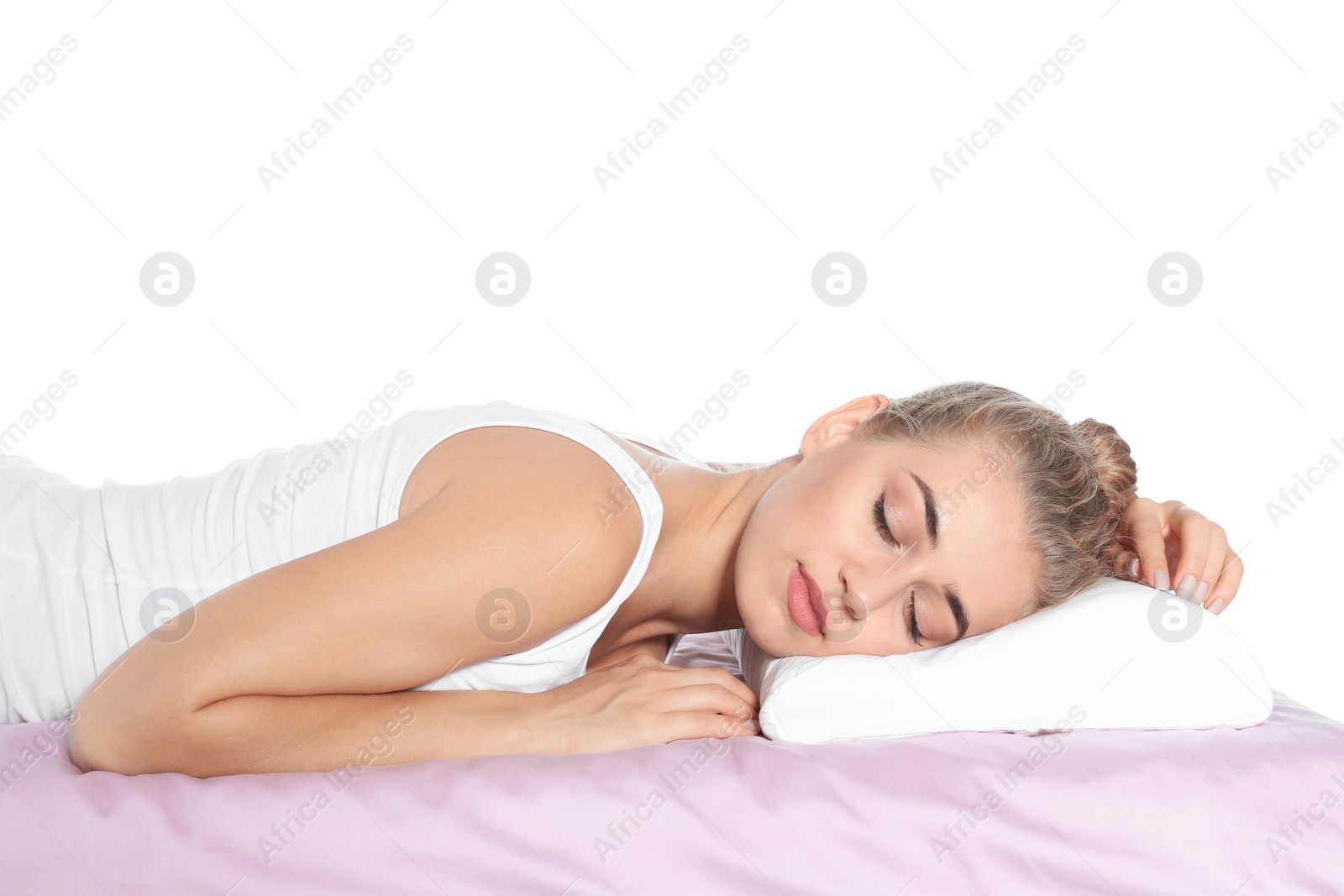 Photo of Beautiful woman sleeping with orthopedic pillow on bed against white background