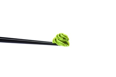 Photo of Chopsticks with swirl of wasabi paste isolated on white