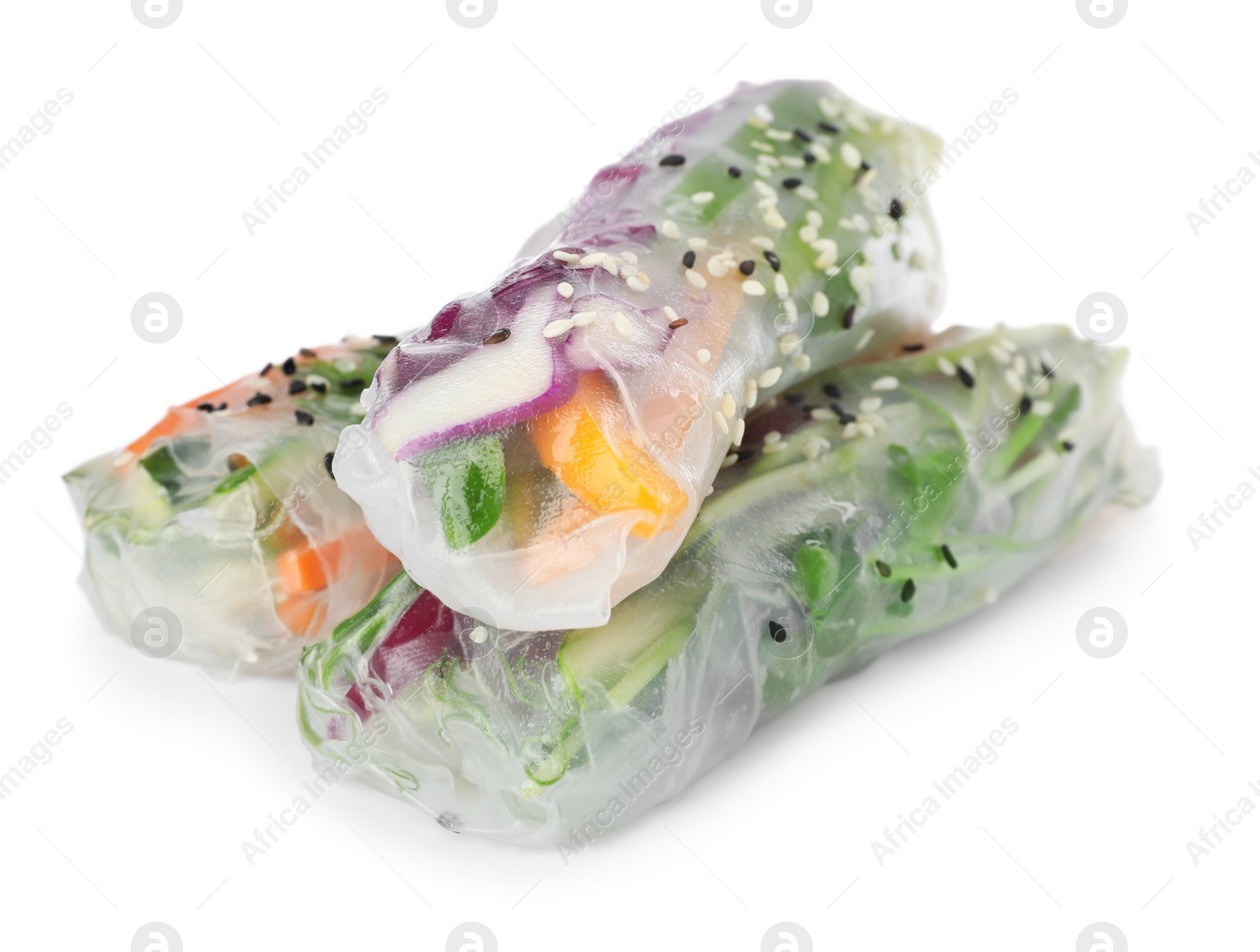 Photo of Many different rolls wrapped in rice paper on white background