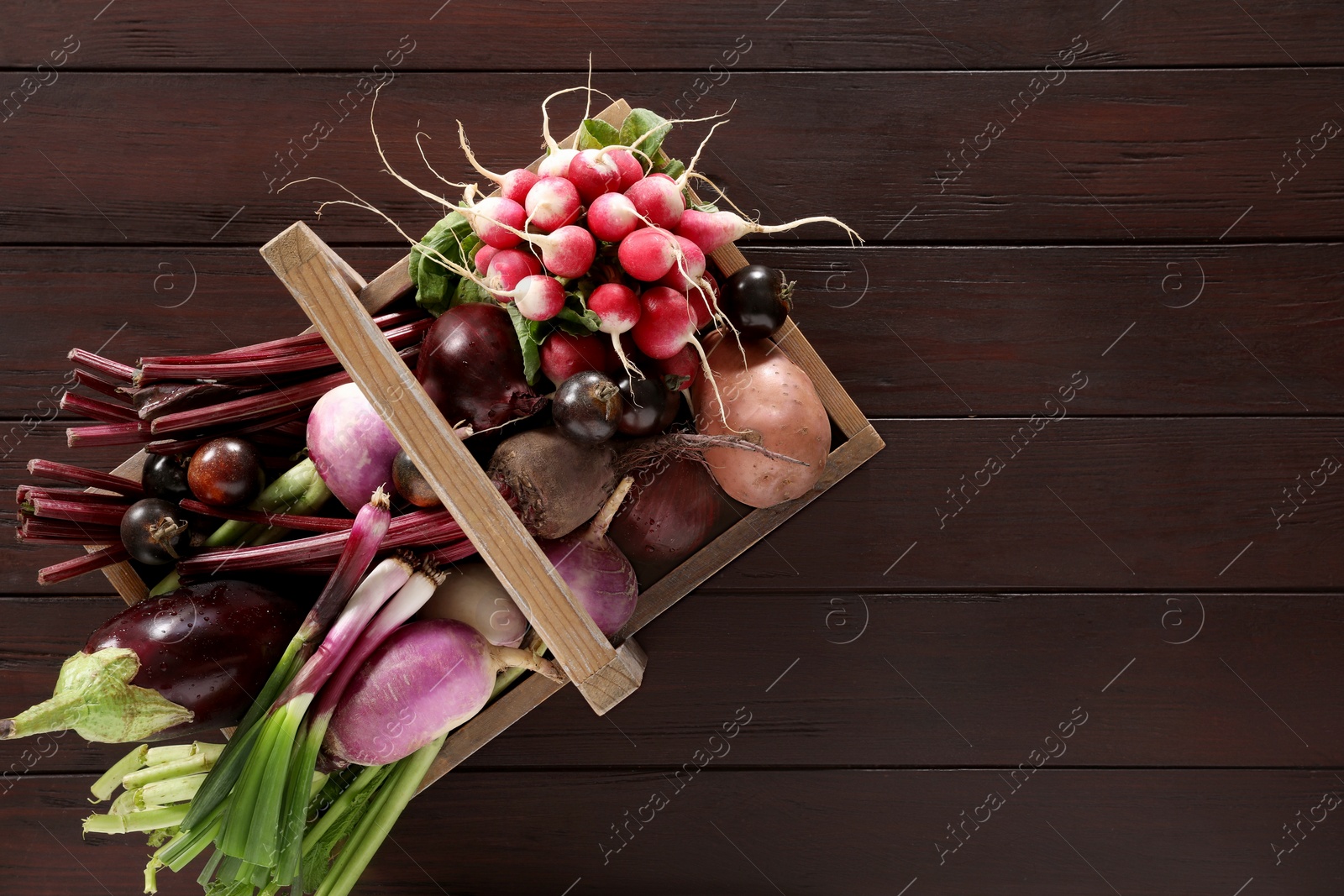 Photo of Different fresh ripe vegetables on wooden table, top view. Space for text