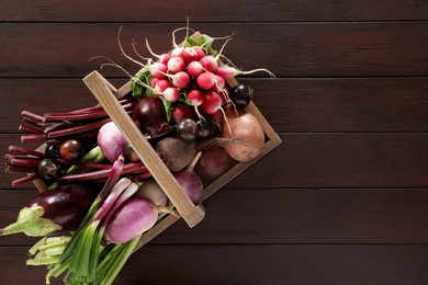 Photo of Different fresh ripe vegetables on wooden table, top view. Space for text