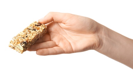 Photo of Woman holding grain cereal bar on white background. Healthy snack