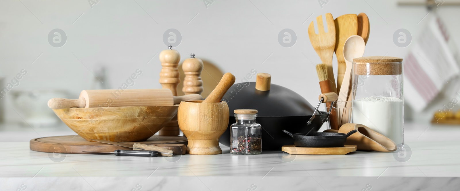 Image of Set of cooking utensils and products on white table in kitchen, banner design