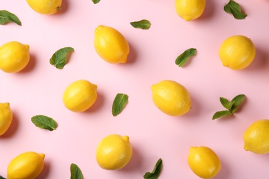 Flat lay composition with fresh ripe lemons and mint leaves on color background