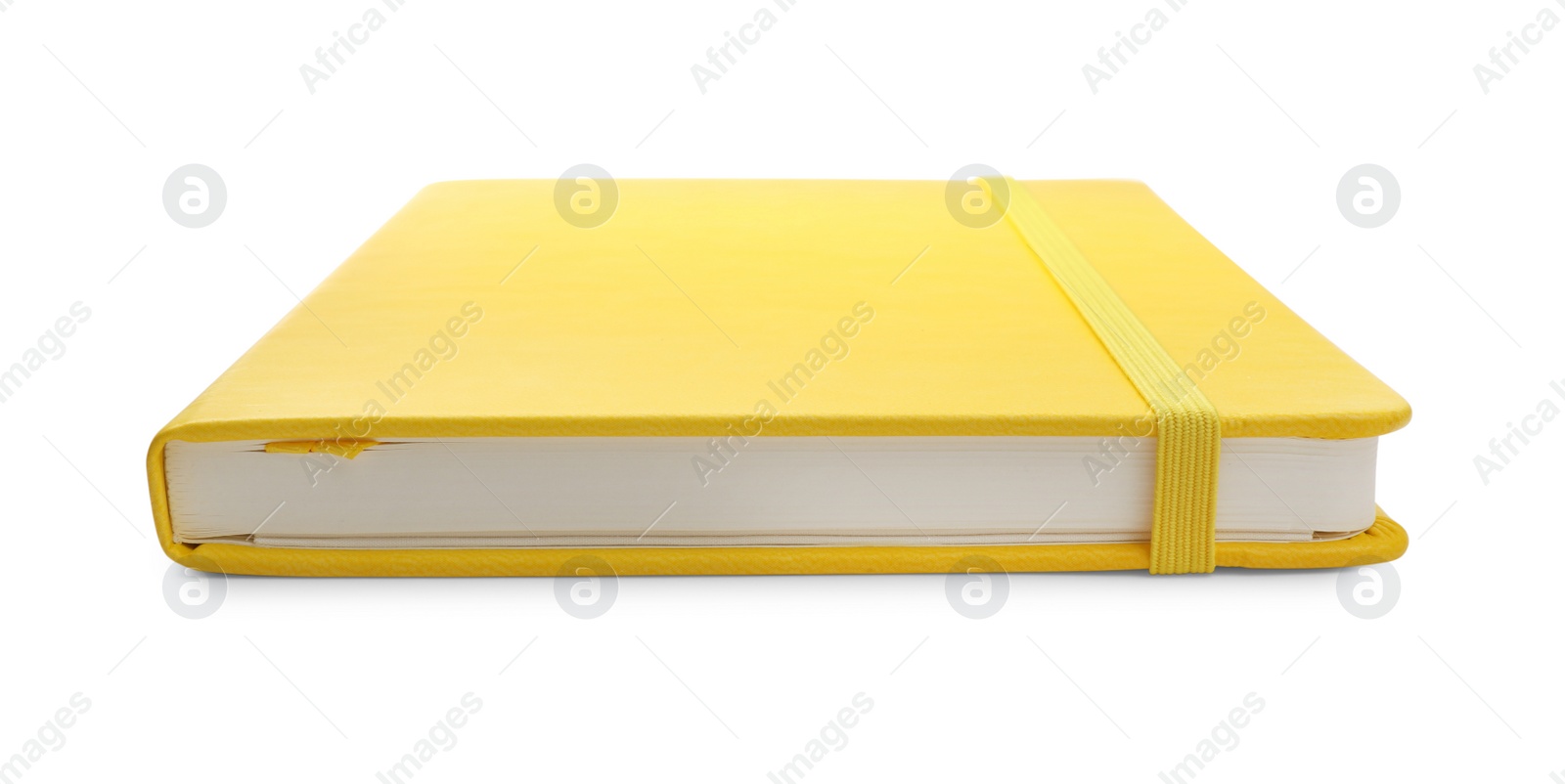 Photo of Closed yellow office notebook isolated on white