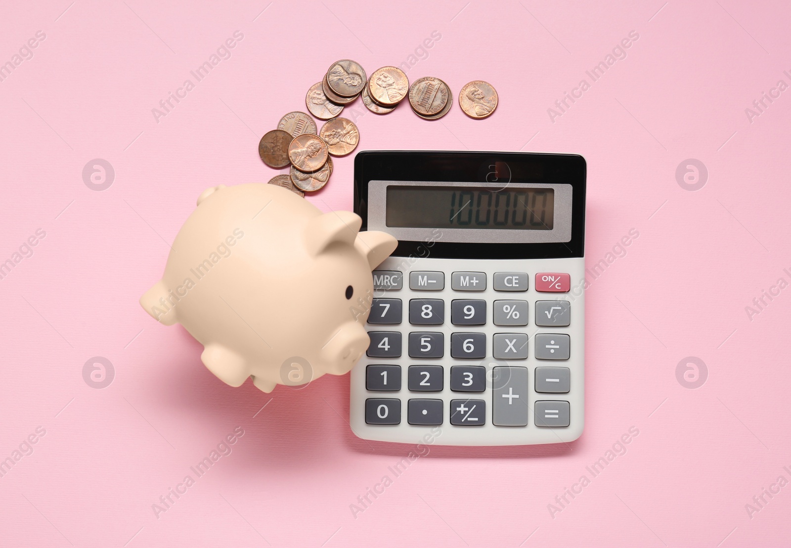 Photo of Calculator, coins and piggy bank on pink background, flat lay