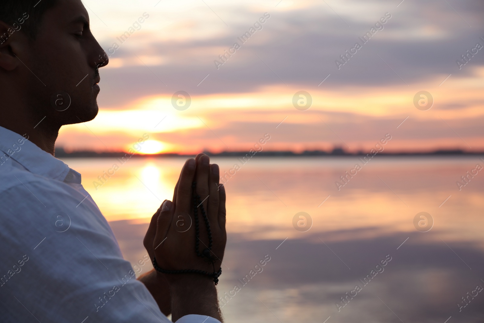 Photo of Man near river at sunset, space for text. Nature healing power