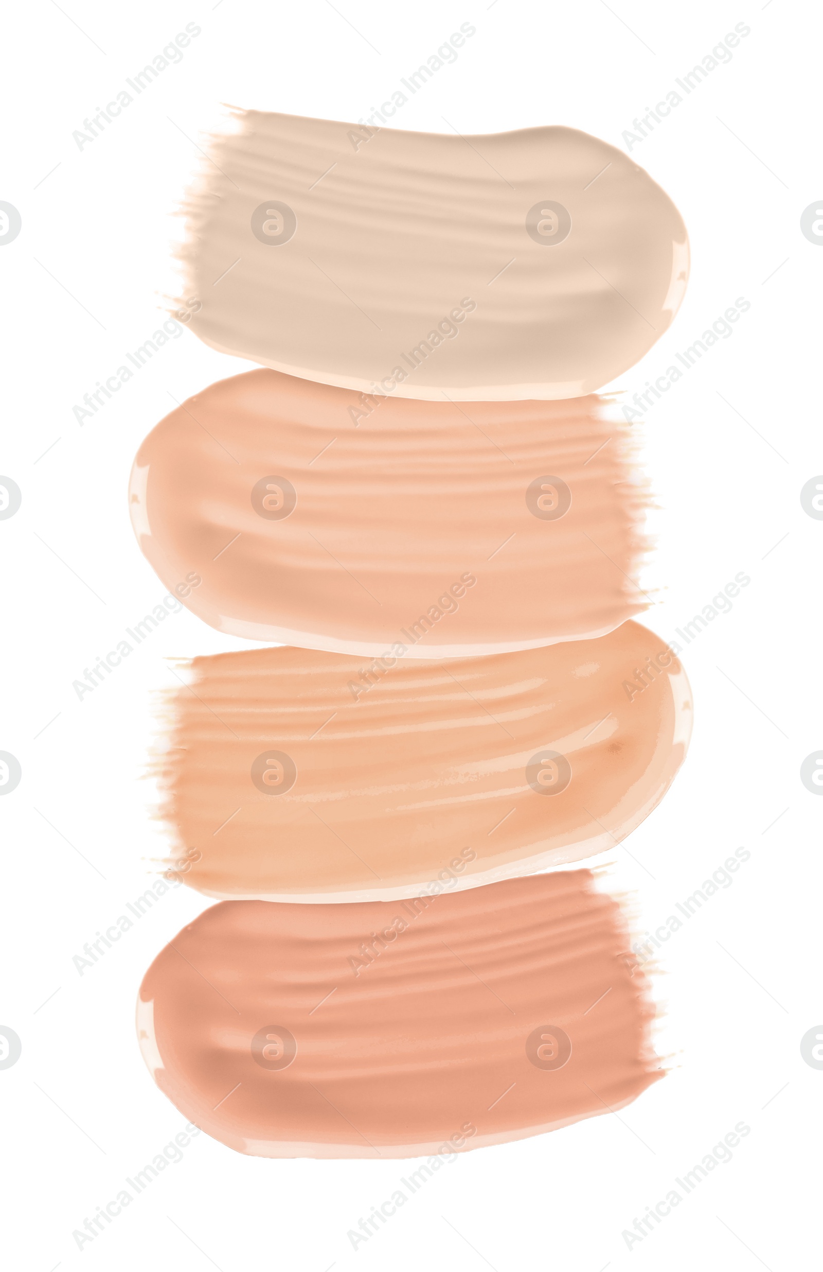 Image of Set of different foundation shades on white background, top view