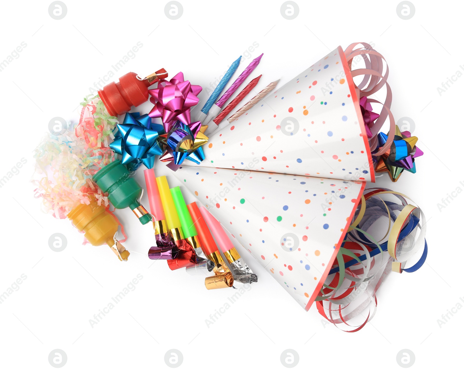 Photo of Party crackers and different festive items on white background, top view