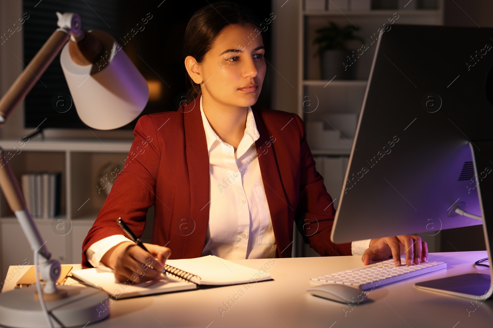 Photo of Tired businesswoman working at table in office