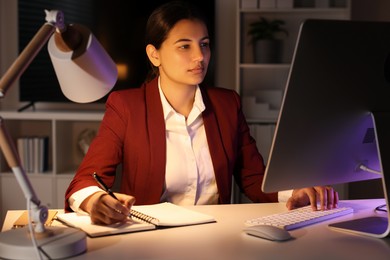 Tired businesswoman working at table in office