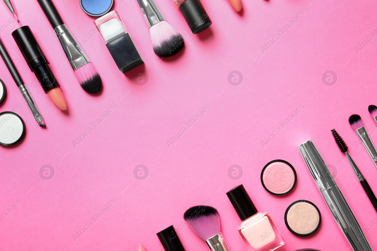 Photo of Flat lay composition with products for decorative makeup on pink background