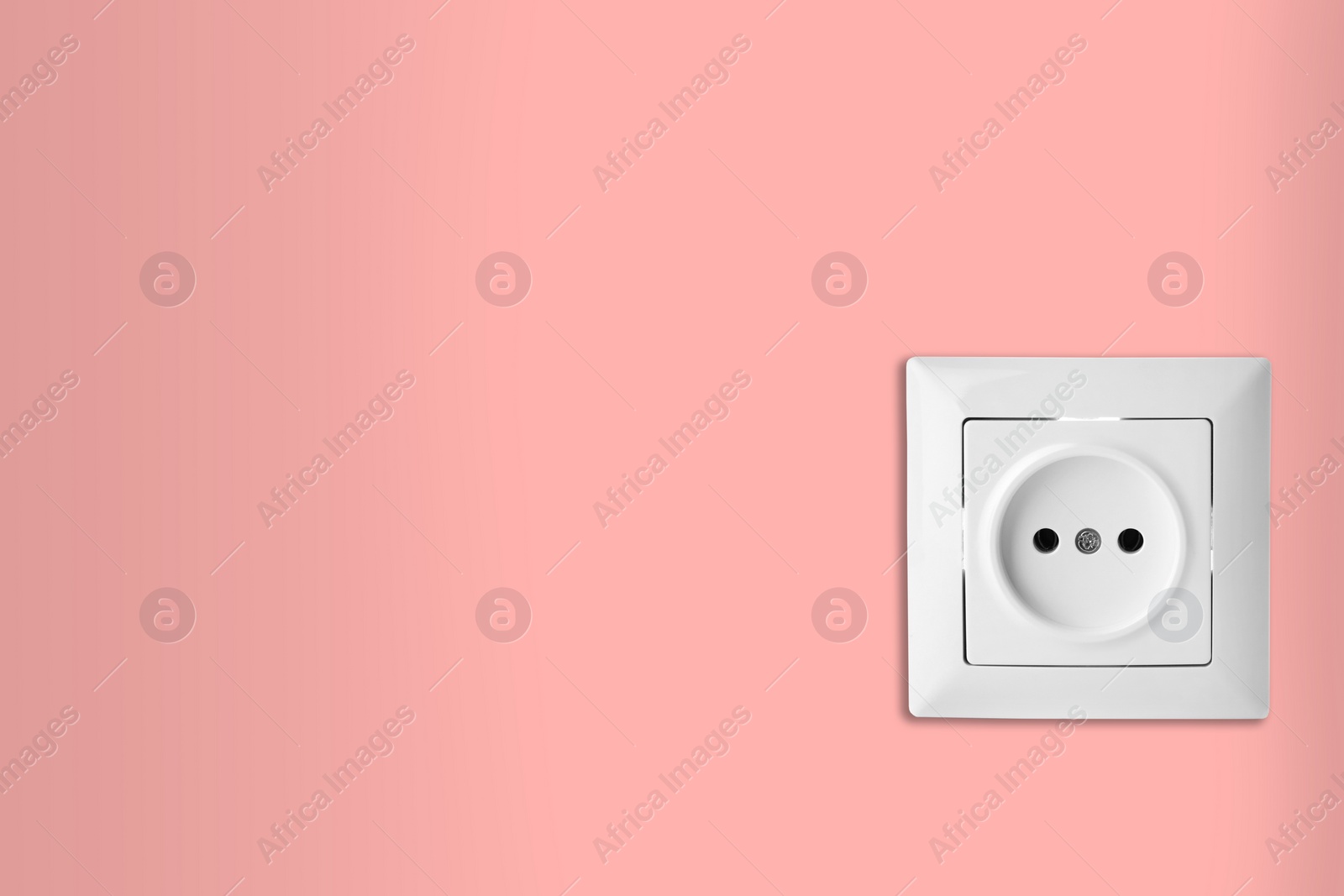 Pink wall with power socket, space for text. Electrical supply Image of Pink wall with power socket, space for text. Electrical supply