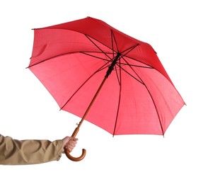 Woman with open red umbrella on white background, closeup