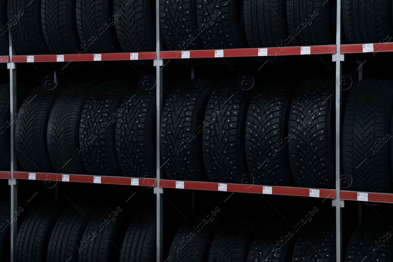 Photo of Car tires on rack in auto store