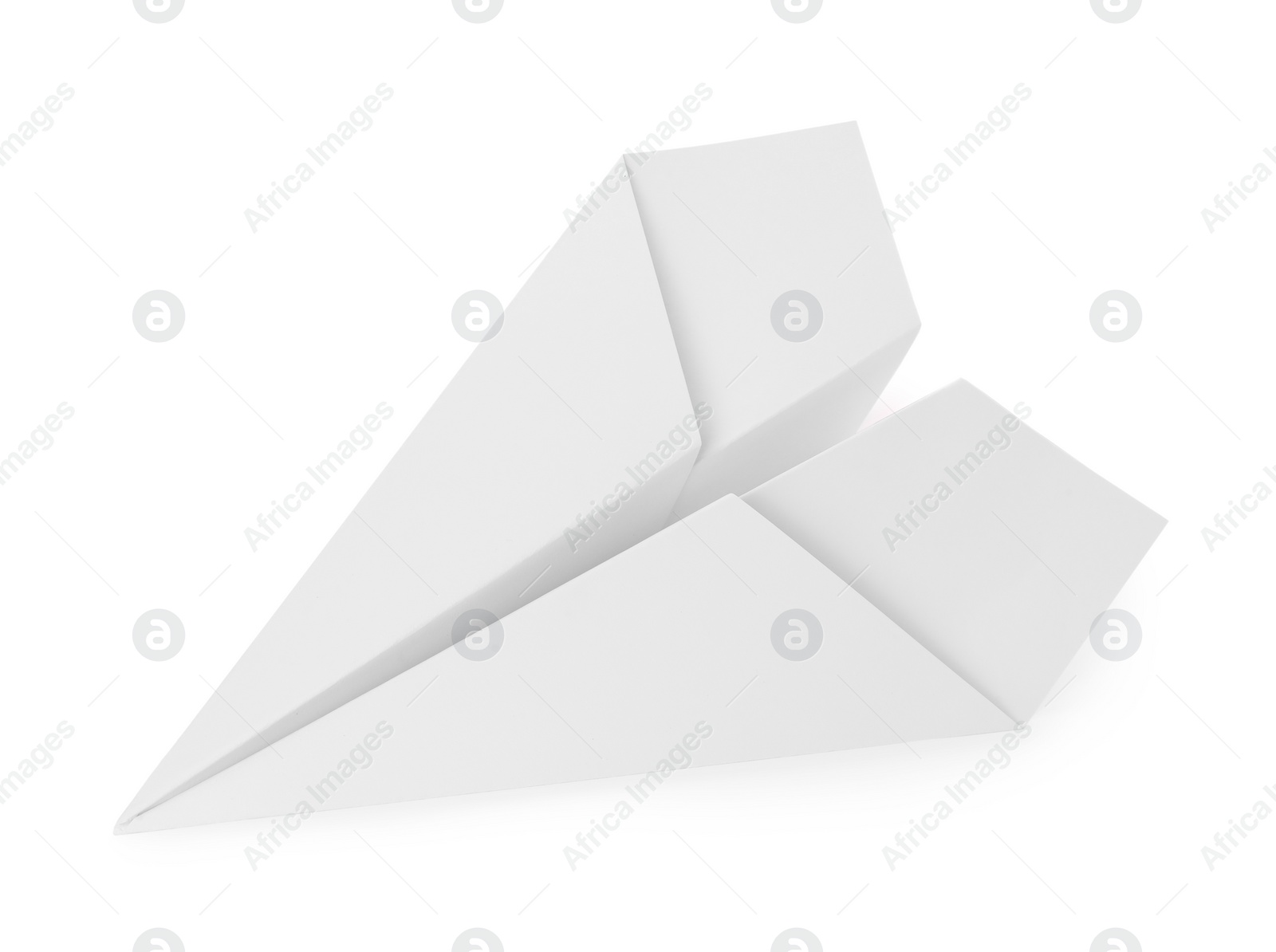 Photo of One handmade paper plane isolated on white