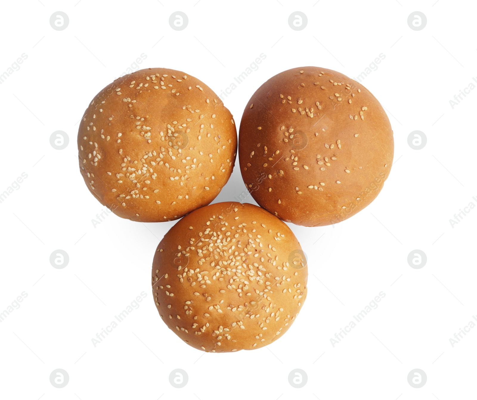 Photo of Fresh tasty buns with sesame seeds isolated on white, top view