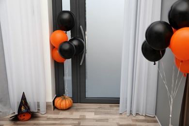 Spacious hallway with balloons and pumpkins decorated for Halloween