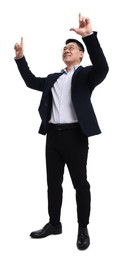 Businessman in suit posing on white background, low angle view