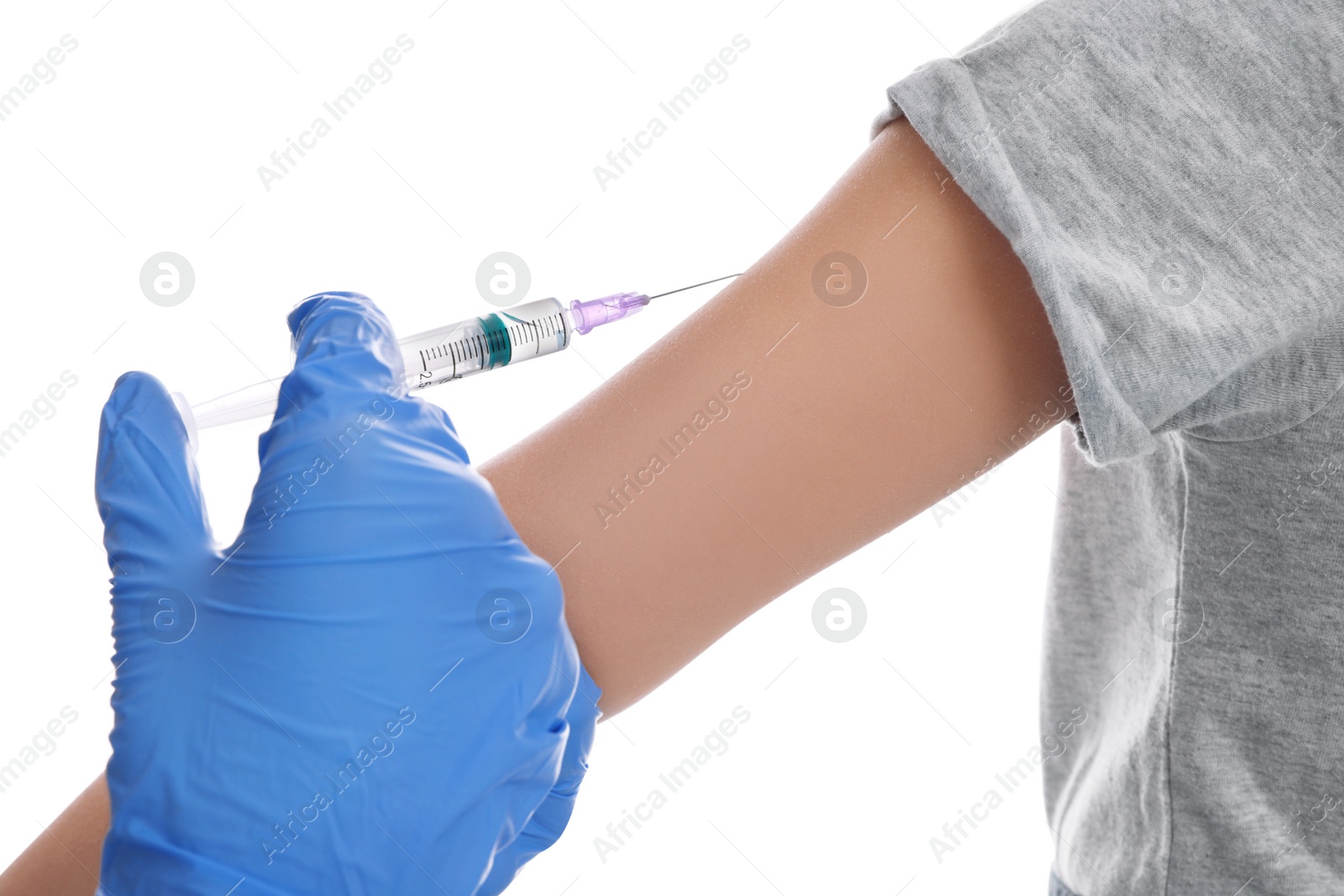 Photo of Little girl receiving chickenpox vaccination on white background, closeup. Varicella virus prevention